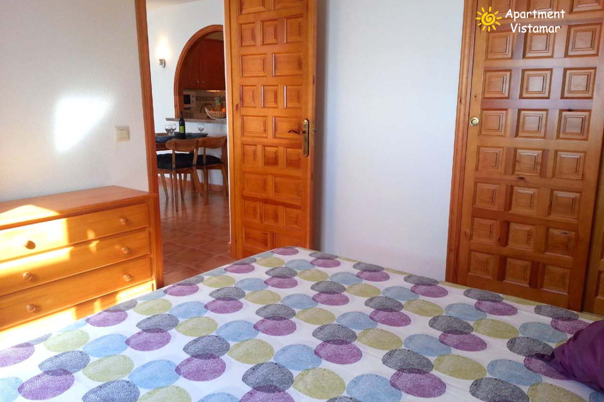 Dormitorio y zona de estar de Apartment Vistamar 2